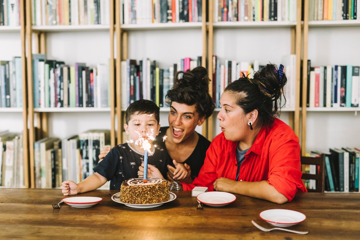 Lesbian parents celebrating son's birthday at home